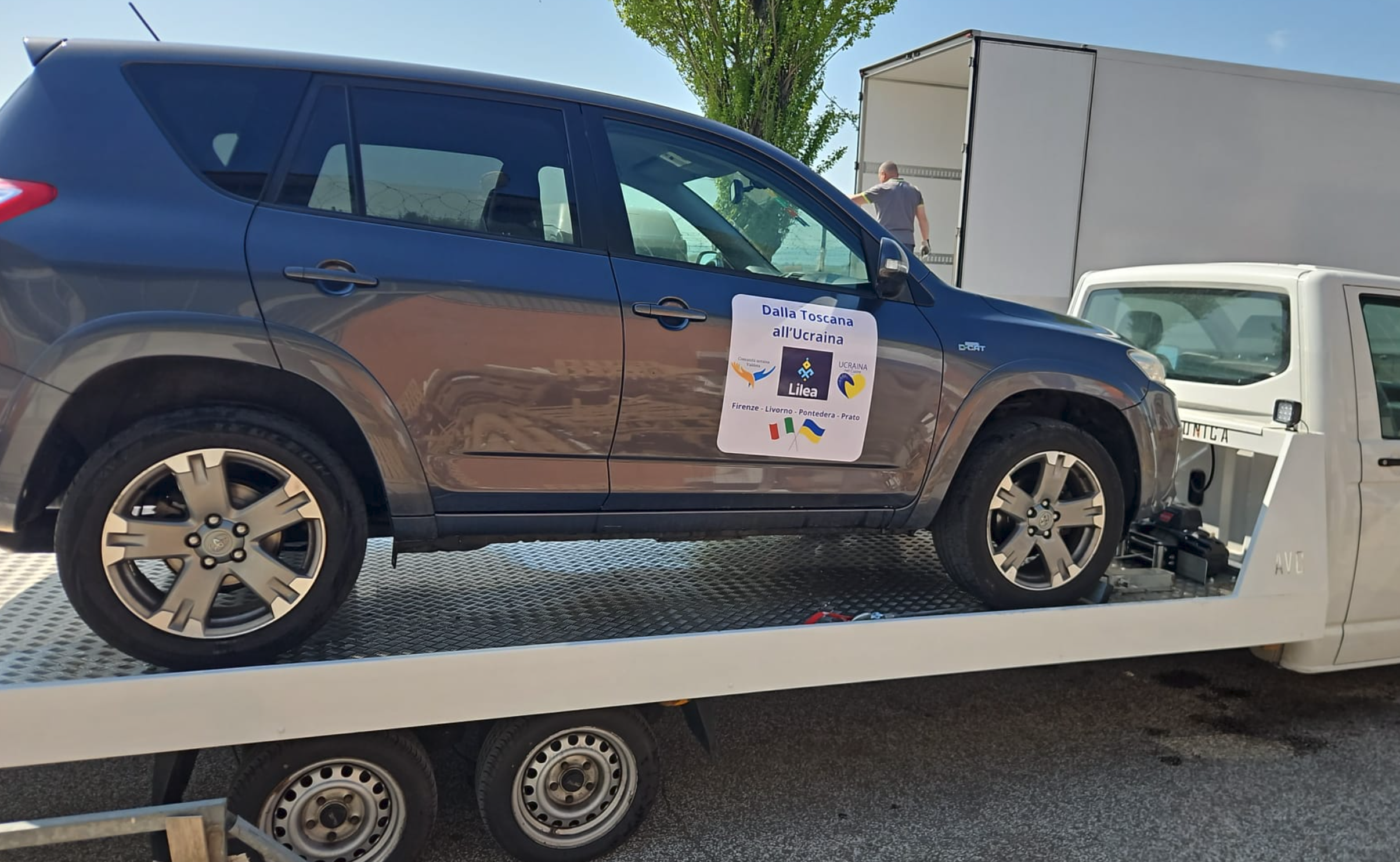 One SUV being loaded for transport